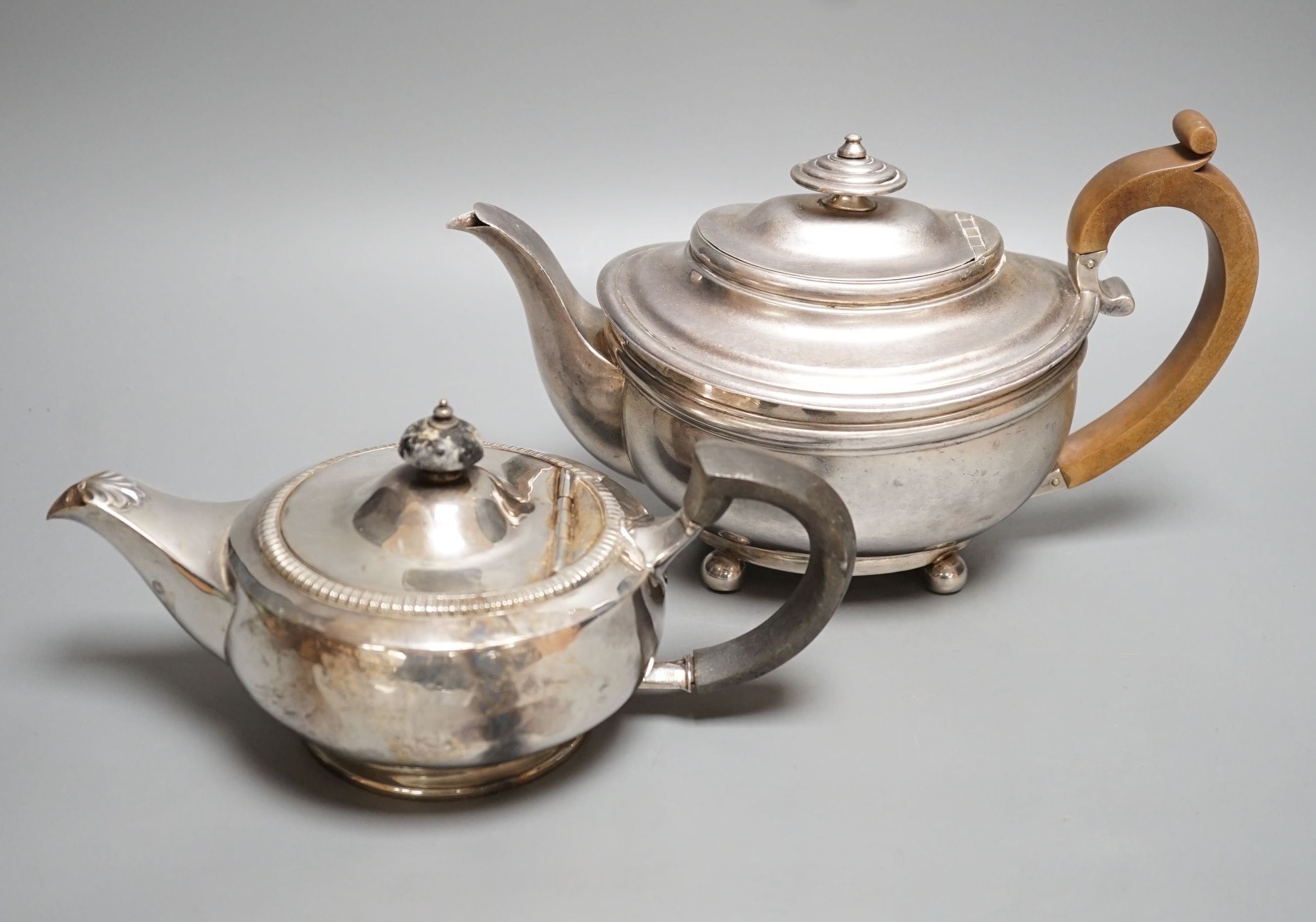 A George III silver teapot, Soloman Hougham, London, 1816 and a 20th century squat silver teapot, gross 31.5oz.